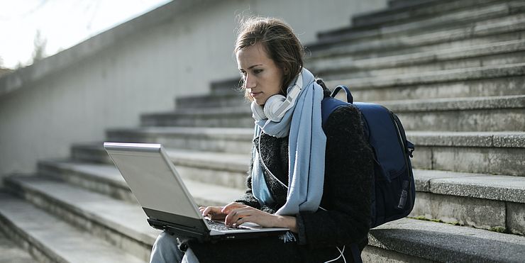 Young woman working on a laptop.