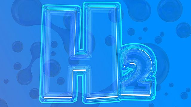 Immagine dell’elemento chimico dell’idrogeno “H2” su sfondo blu.