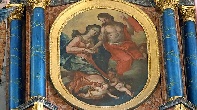 © Wikipedia/Thomas Hummel – CC BY-SA 4.0 Auszug aus dem Hochaltar von St. Mariä Himmelfahrt in Vils: Maria wird von Christus im Himmel begrüßt.
